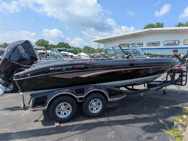 Slide: The Image of 2025 Ranger 2080MS boat on trailer, parked outdoors under a partly cloudy sky. - 4