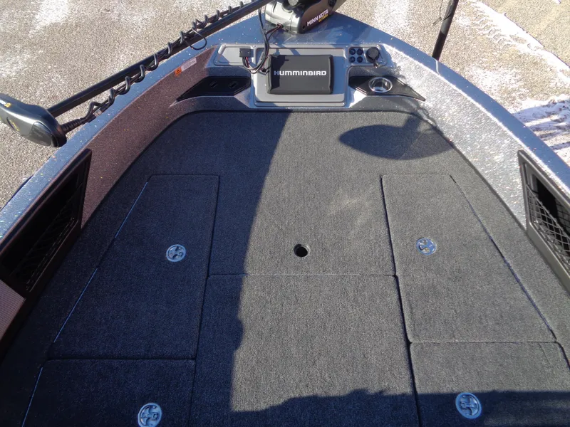 Slide: The Image of 2025 Ranger 1880MS boat deck with Humminbird electronics and storage compartments. - 10