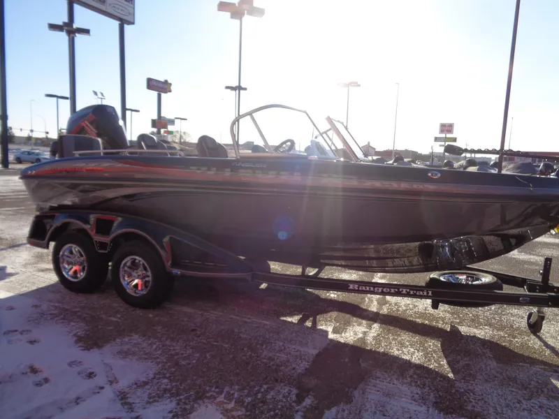 Slide: The Image of 2025 Ranger 1880MS boat on trailer in sunny outdoor setting. - 4