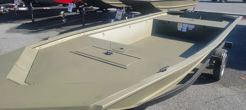 Slide: The Image of 2025 Tracker Grizzly 1648 Jon boat on trailer, displayed outdoors. - 2