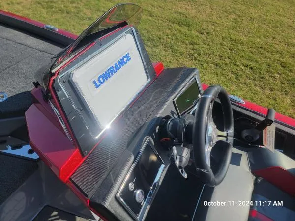 Slide: The Image of 2025 Ranger Z520R Cup-Equipped boat dashboard with Lowrance display and steering wheel. - 10