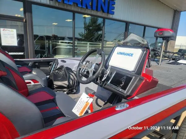 Slide: The Image of 2025 Ranger Z520R Cup-Equipped boat interior with Lowrance display, red and black seating. - 14