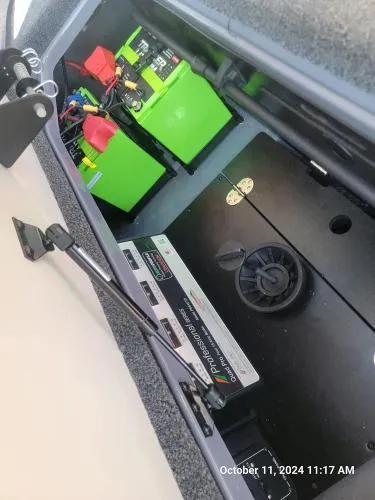 Slide: The Image of 2025 Ranger Z520R Cup-Equipped boat battery compartment with wiring and components. - 6