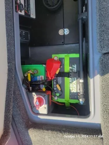 Slide: The Image of 2025 Ranger Z520R Cup-Equipped boat battery compartment with wiring and components. - 7