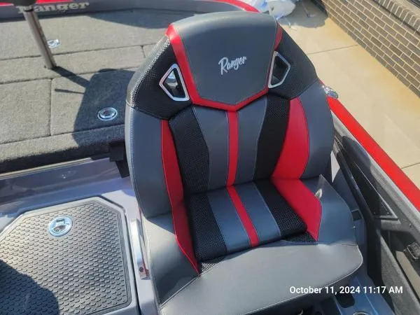 Slide: The Image of 2025 Ranger Z520R Cup-Equipped boat seat with red and black design. - 8