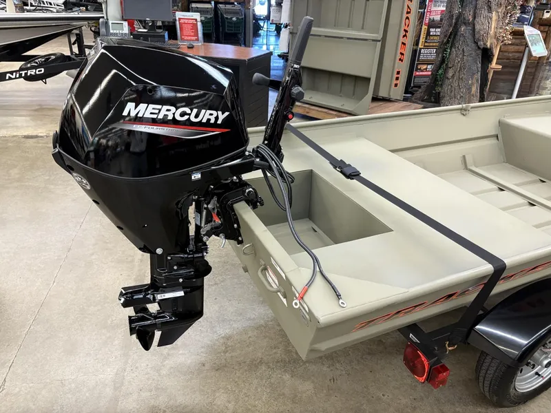Slide: The Image of 2025 Tracker Grizzly 1542 Utility boat with Mercury outboard motor in showroom. - 4