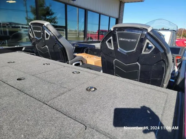 Slide: The Image of 2025 Ranger Z520R Cup-Equipped boat interior with seats and deck, photographed outdoors. - 4