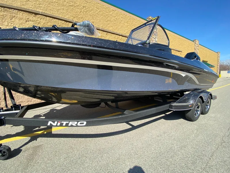 The Image of 2025 Nitro ZV21 Pro boat on trailer, parked outdoors, sunny day. - 0