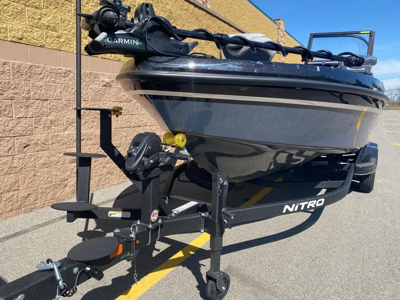 Slide: The Image of 2025 Nitro ZV21 Pro boat on trailer with Garmin equipment, parked outdoors. - 3