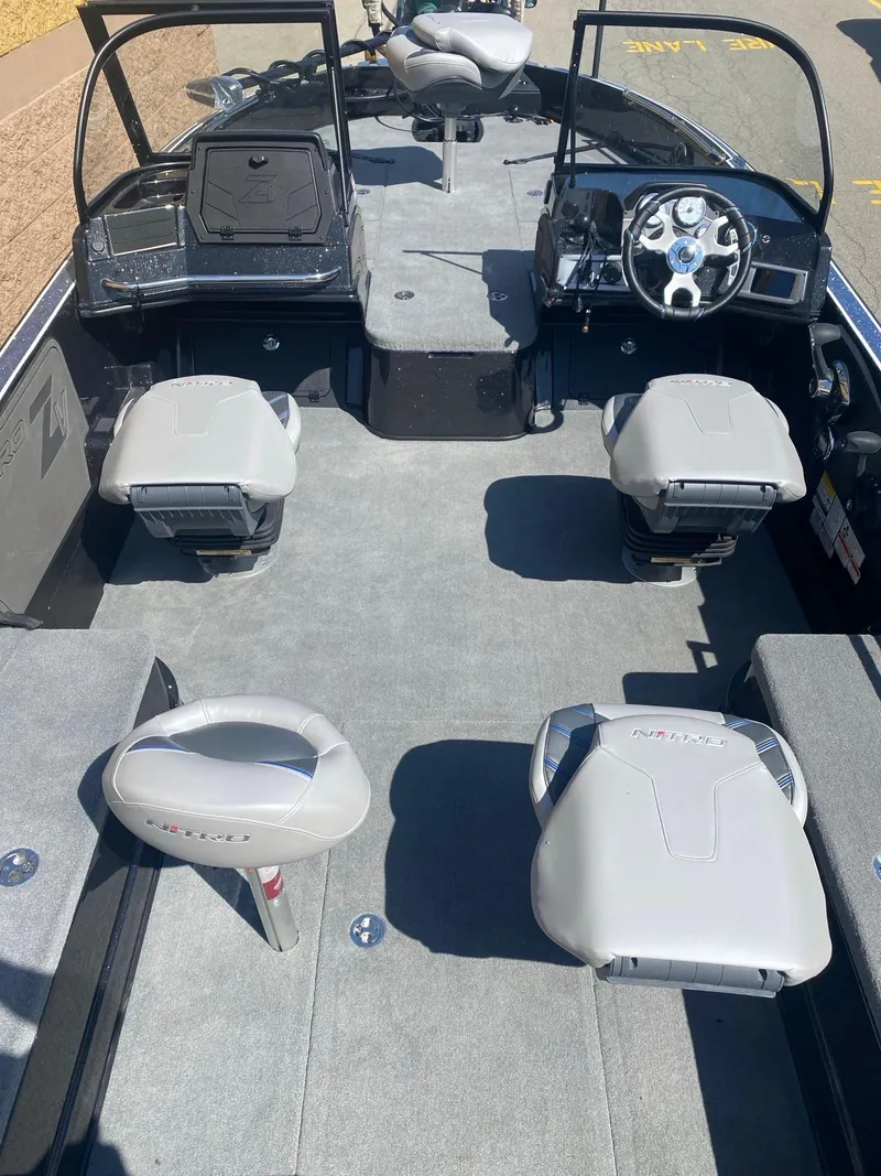 Slide: The Image of 2025 Nitro ZV21 Pro boat interior with gray seating and modern dashboard. - 5