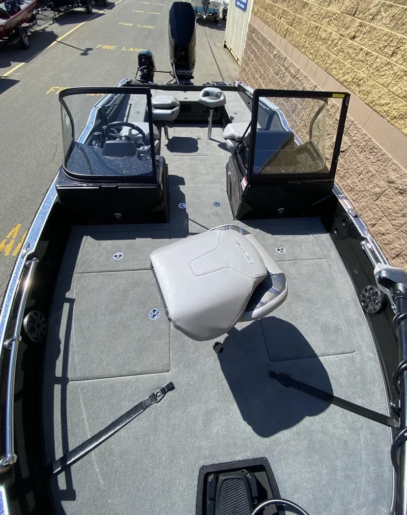 Slide: The Image of 2025 Nitro ZV21 Pro fishing boat interior with seating and steering console. - 6