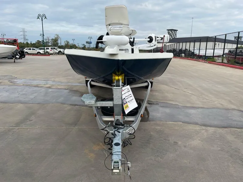 Slide: The Image of 2025 Ranger RB210 boat on trailer in parking lot. - 2