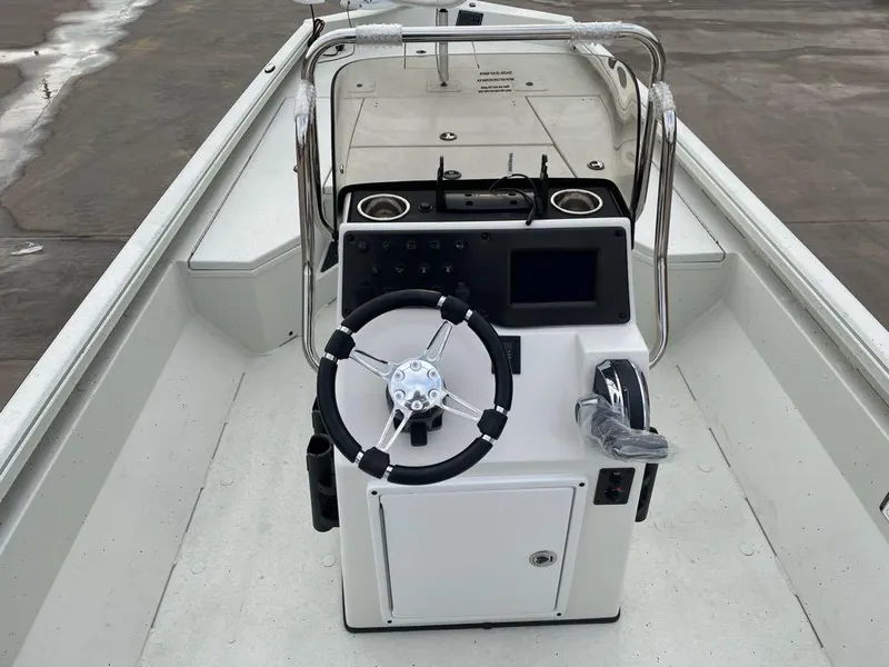 Slide: The Image of 2025 Ranger RB210 boat console with steering wheel and controls. - 4