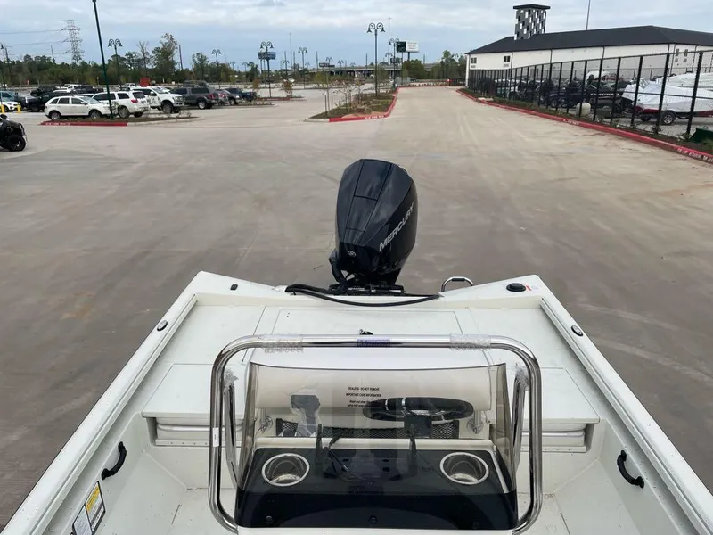 Slide: The Image of 2025 Ranger RB210 boat with outboard motor in parking lot. - 5