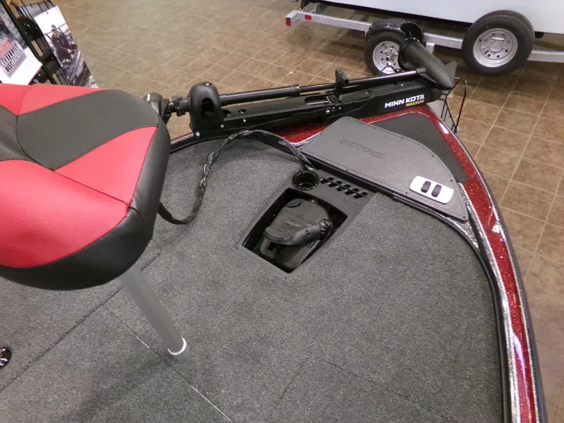 Slide: The Image of Red and black seat on 2025 Nitro Z18 boat deck with Minn Kota trolling motor. - 4