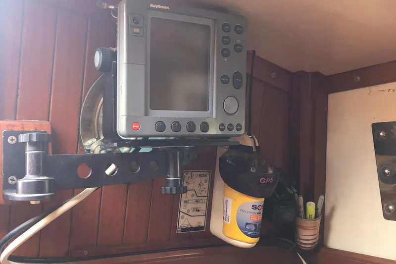 Slide: The Image of Navigation equipment inside 1985 Tayana 37 sailboat cabin. - 16