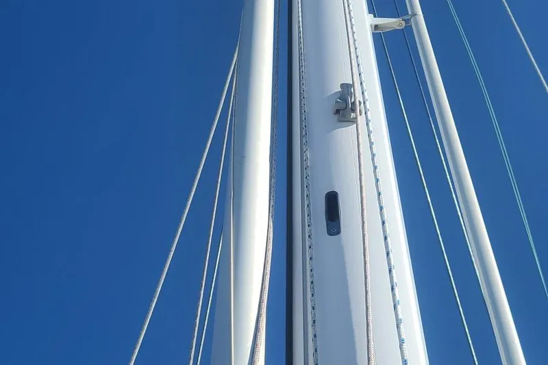 Slide: The Image of Close-up of Tayana 37 sailboat mast against clear blue sky, 1985 model. - 25