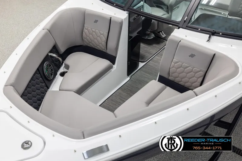 Slide: The Image of 2025 Four Winns H2 boat interior with gray seating and hexagonal pattern accents. - 10