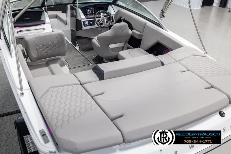 Slide: The Image of 2025 Four Winns H2 boat interior with modern seating and steering console. - 11