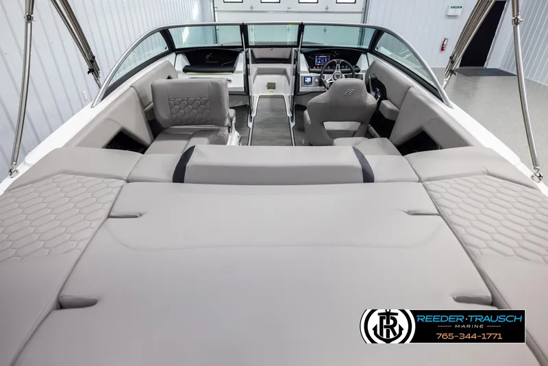 Slide: The Image of 2025 Four Winns H2 boat interior with modern seating and dashboard, showcased by Reeder-Trausch Marine. - 13