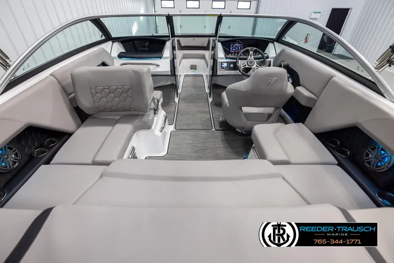 Slide: The Image of 2025 Four Winns H2 boat interior with modern seating and dashboard design. - 14