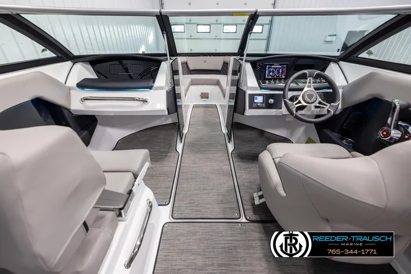 Slide: The Image of 2025 Four Winns H2 boat interior with modern dashboard and seating. - 15