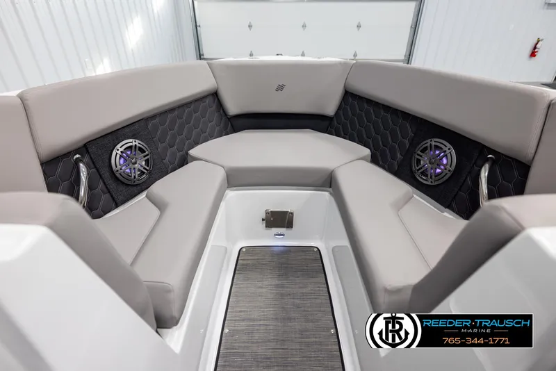 Slide: The Image of 2025 Four Winns H2 boat interior with gray seating and built-in speakers. - 16