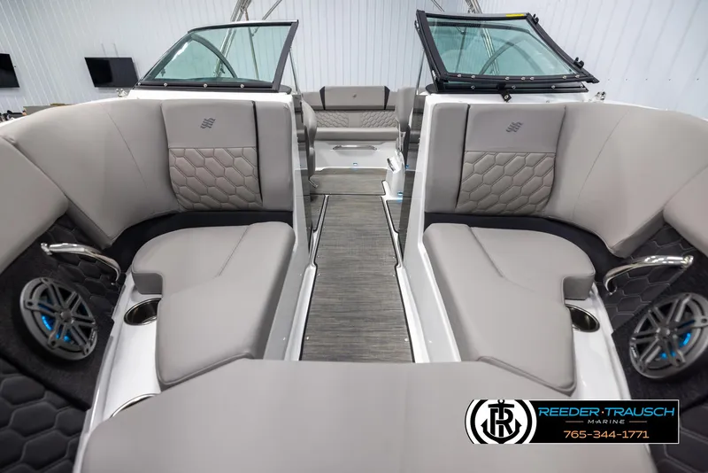 Slide: The Image of 2025 Four Winns H2 boat interior with gray seating and modern design. - 17