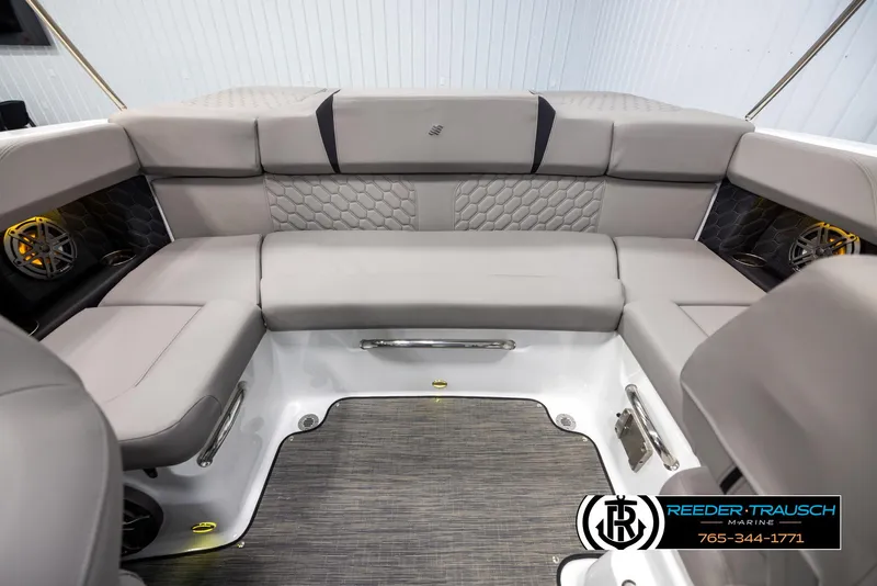 Slide: The Image of 2025 Four Winns H2 boat interior with gray cushioned seating and modern design. - 19