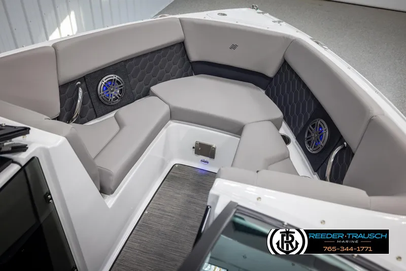 Slide: The Image of 2025 Four Winns H2 boat interior with gray seating and built-in speakers. - 20