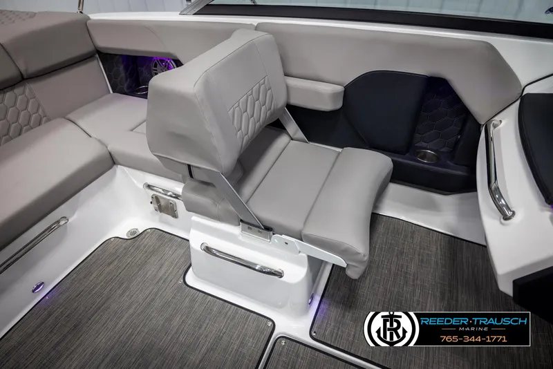 Slide: The Image of 2025 Four Winns H2 boat interior with gray seating and modern design. - 22