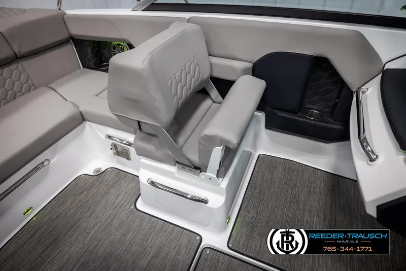 Slide: The Image of 2025 Four Winns H2 boat interior with gray seating and modern design. - 23