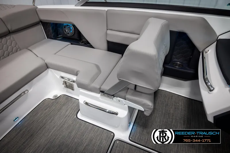Slide: The Image of 2025 Four Winns H2 boat interior with gray seating and modern design. - 24