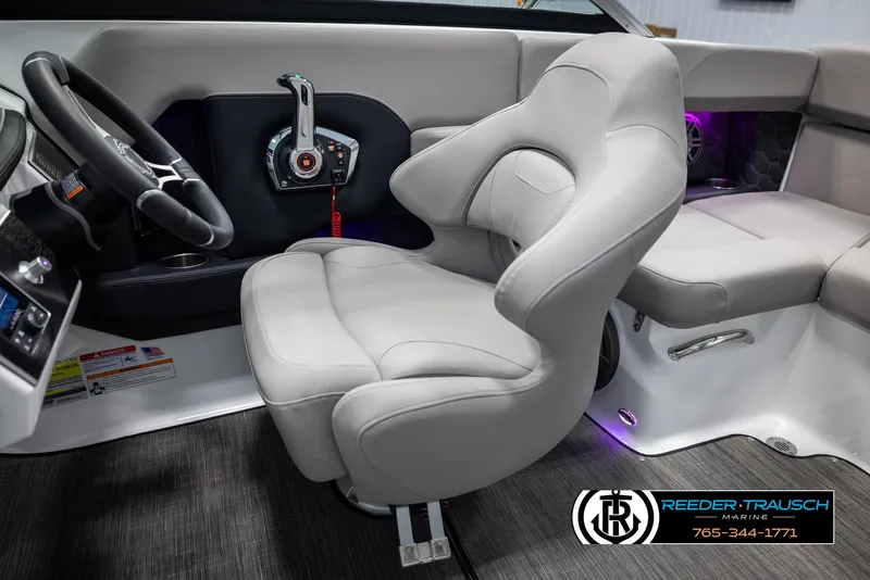 Slide: The Image of Luxurious interior of 2025 Four Winns H2 boat with plush seating and modern controls. - 25