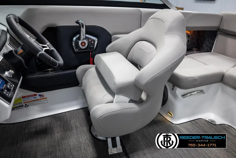 Slide: The Image of Interior of 2025 Four Winns H2 boat with modern steering and seating. - 26
