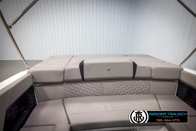 Slide: The Image of 2025 Four Winns H2 boat interior with luxurious gray seating and hexagonal stitching. - 27