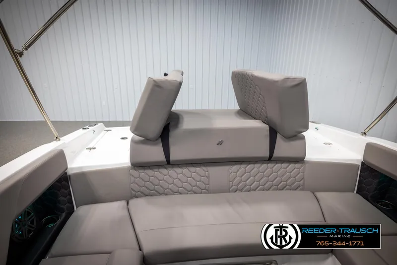 Slide: The Image of 2025 Four Winns H2 boat interior with gray seating and hexagonal pattern design. - 28