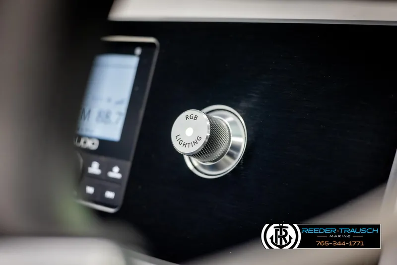 Slide: The Image of 2025 Four Winns H2 boat dashboard with RGB lighting control knob. - 36