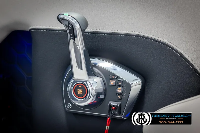 Slide: The Image of Throttle control panel of 2025 Four Winns H2 boat, featuring start/stop button. - 41