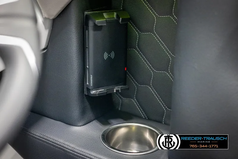Slide: The Image of 2025 Four Winns H2 interior with wireless charger and cup holder. - 42