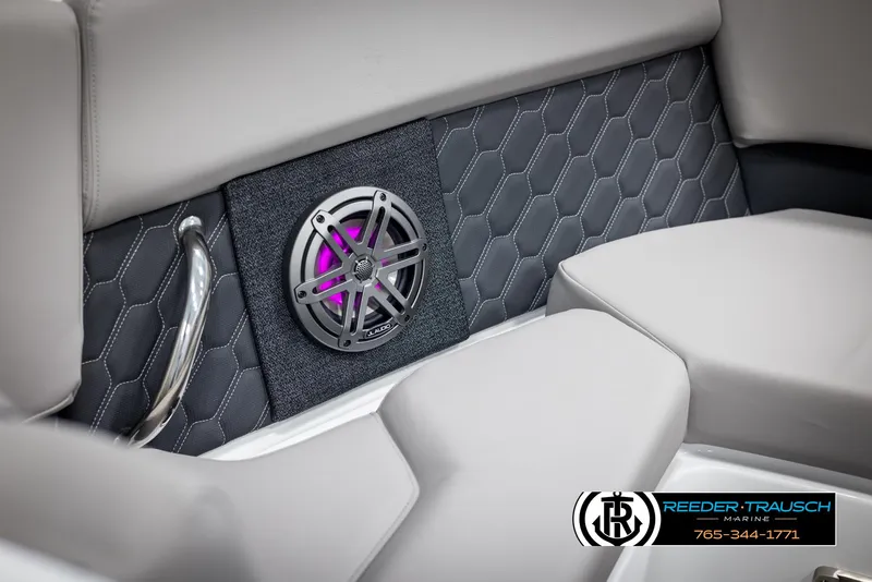 Slide: The Image of 2025 Four Winns H2 boat interior with hexagonal stitching and illuminated speaker. - 44
