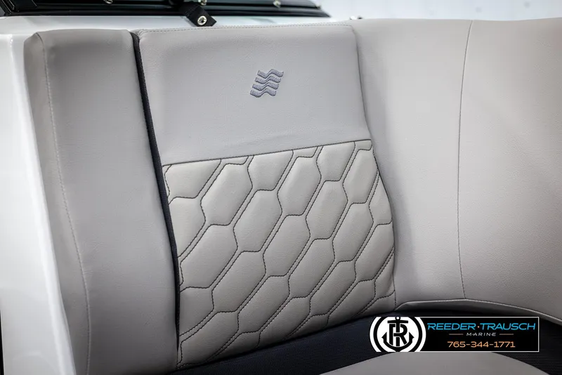 Slide: The Image of 2025 Four Winns H2 boat seat with hexagonal pattern and Reeder-Trausch Marine logo. - 46