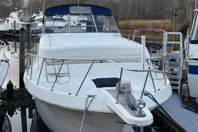 Slide: The Image of 1986 Chris-Craft 381 Catalina yacht docked in a marina. - 1