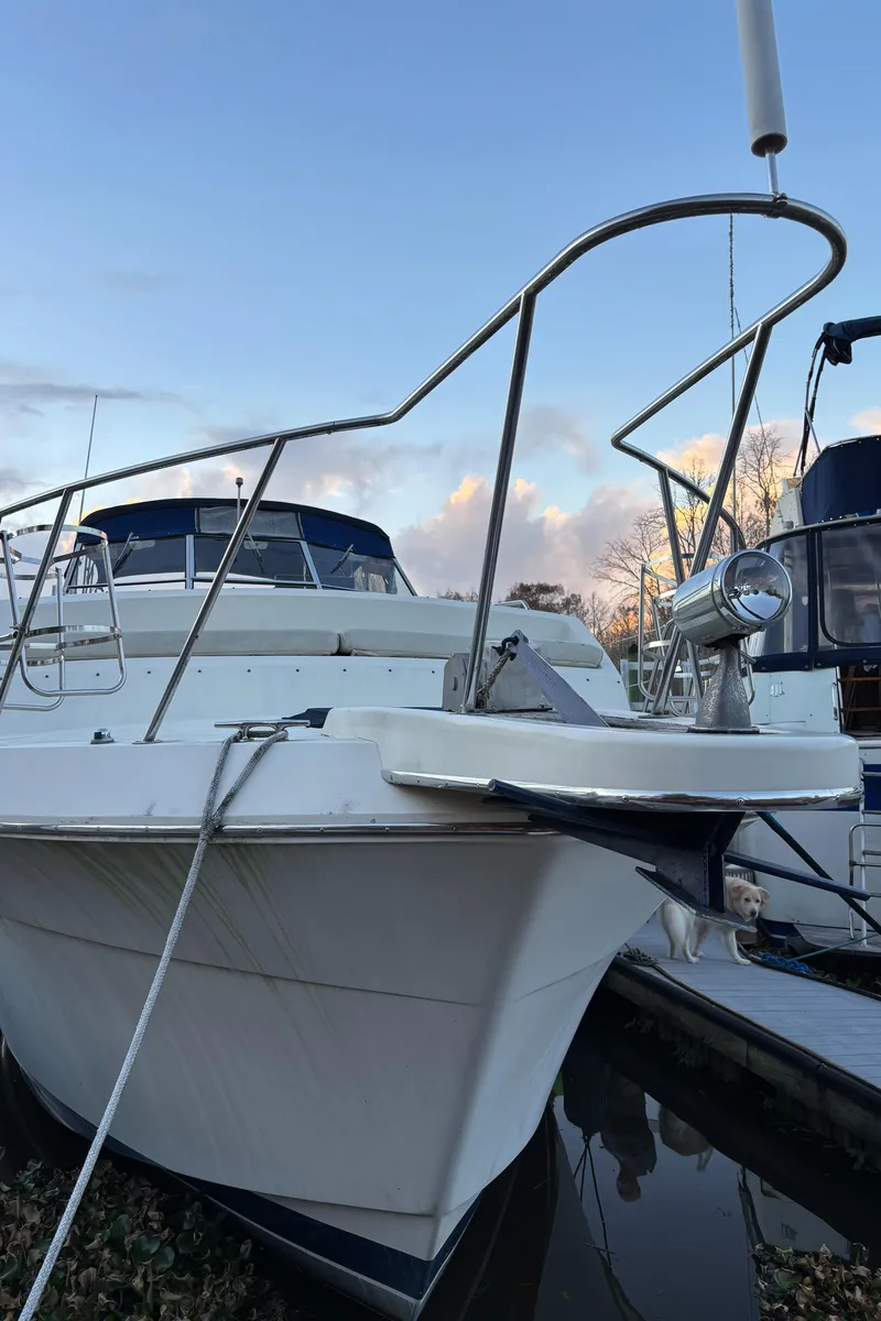 Slide: The Image of 1986 Chris-Craft 381 Catalina boat docked at sunset. - 14