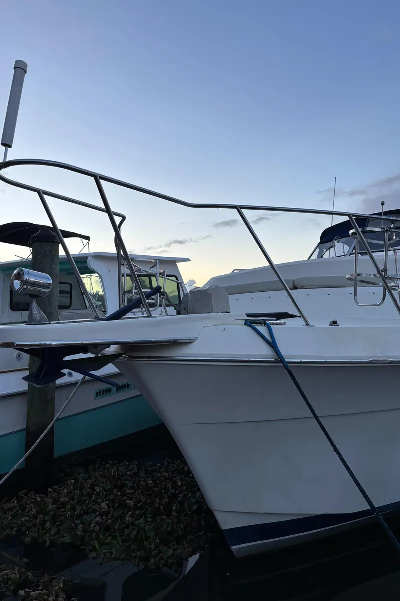 Slide: The Image of 1986 Chris-Craft 381 Catalina docked at sunset, side view. - 17