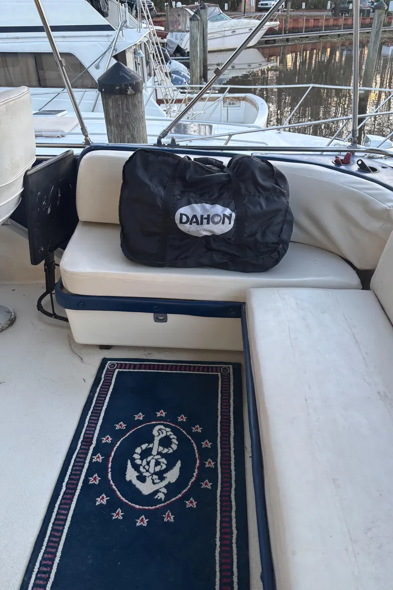 Slide: The Image of 1986 Chris-Craft 381 Catalina boat interior with Dahon bag on seating area. - 20