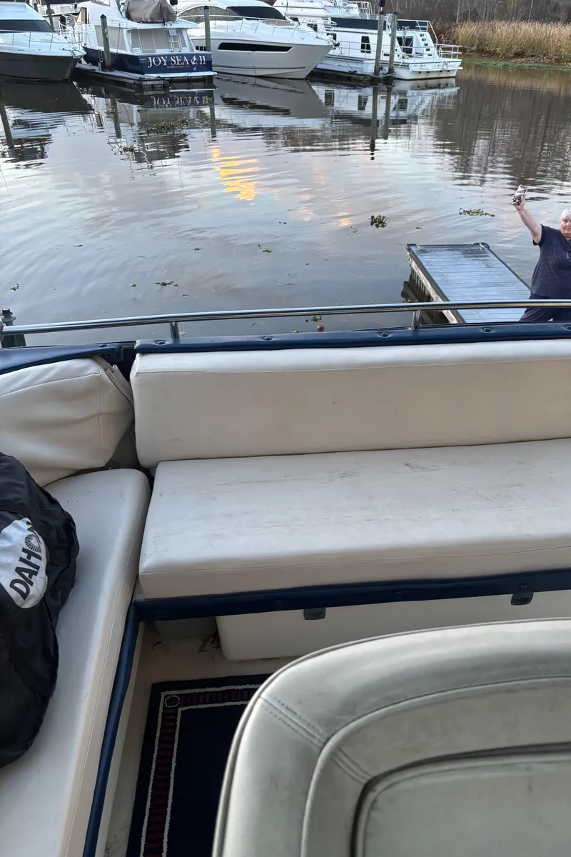 Slide: The Image of 1986 Chris-Craft 381 Catalina interior with dock view and nearby boats. - 23