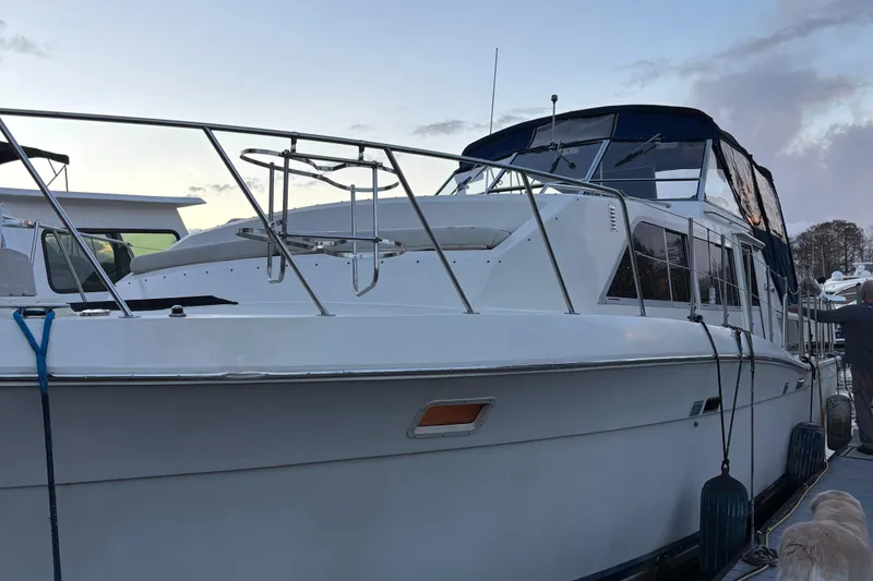 Slide: The Image of 1986 Chris-Craft 381 Catalina yacht docked at sunset. - 3