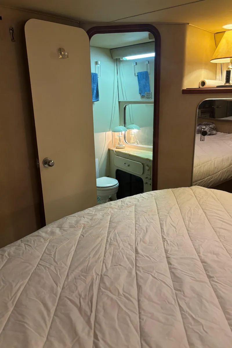 Slide: The Image of Interior of 1986 Chris-Craft 381 Catalina yacht with cozy bedroom and bathroom. - 35