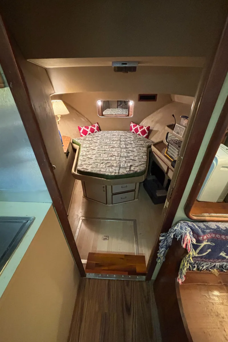 Slide: The Image of 1986 Chris-Craft 381 Catalina cabin interior with bed and cozy decor. - 42